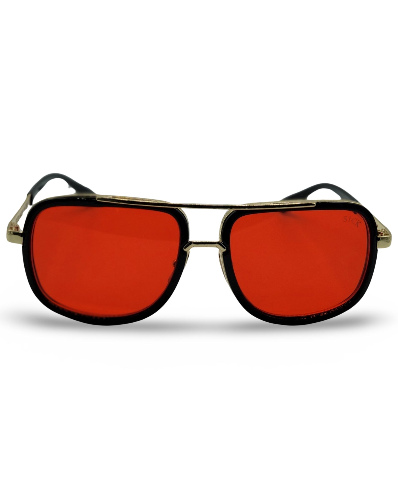 a pair of orange glasses sitting on top of a white surface